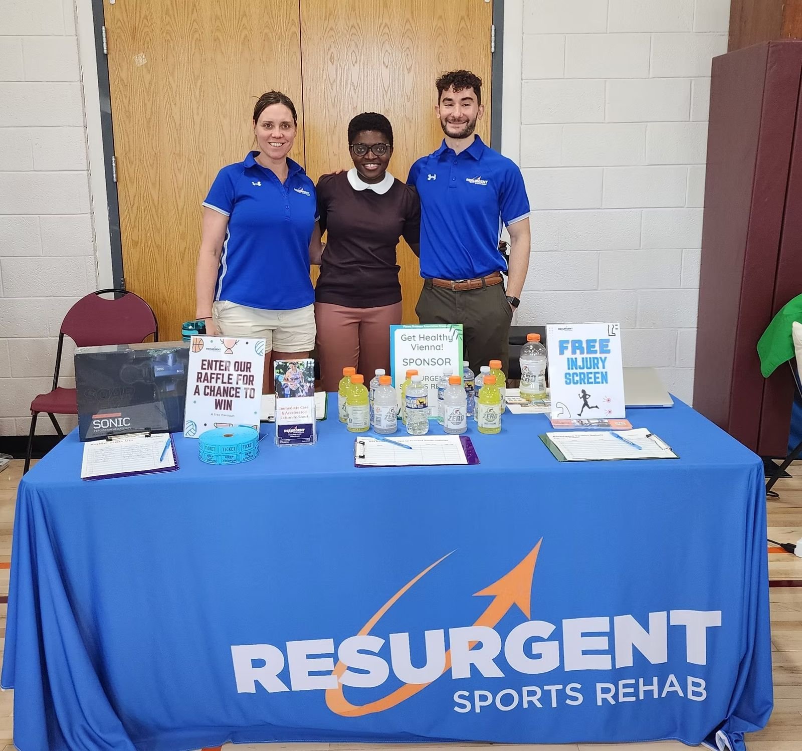 Resurgent Sports Rehab team at their exhibitor table